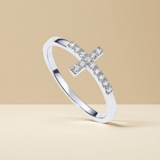 Close-up of gold plated cross ring, cubic zirconia stackable finger ring