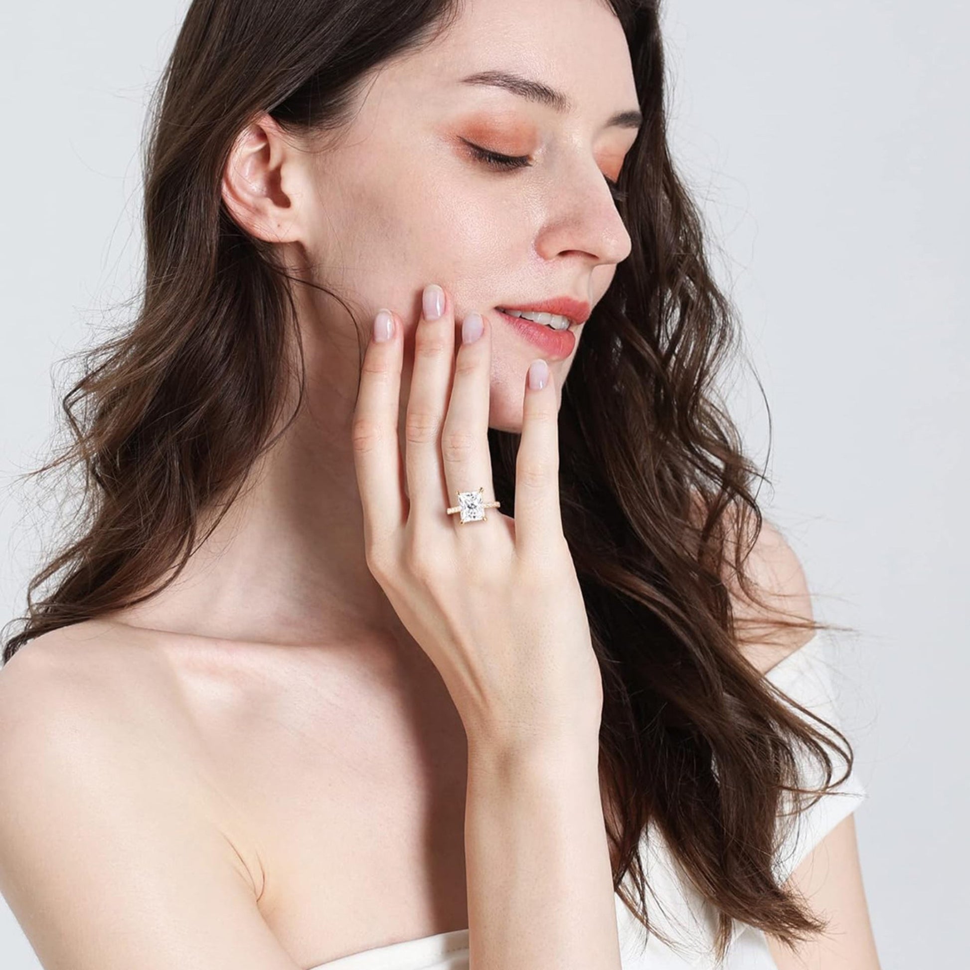 Woman wearing a rectangular diamond ring, stylish everyday statement jewelry