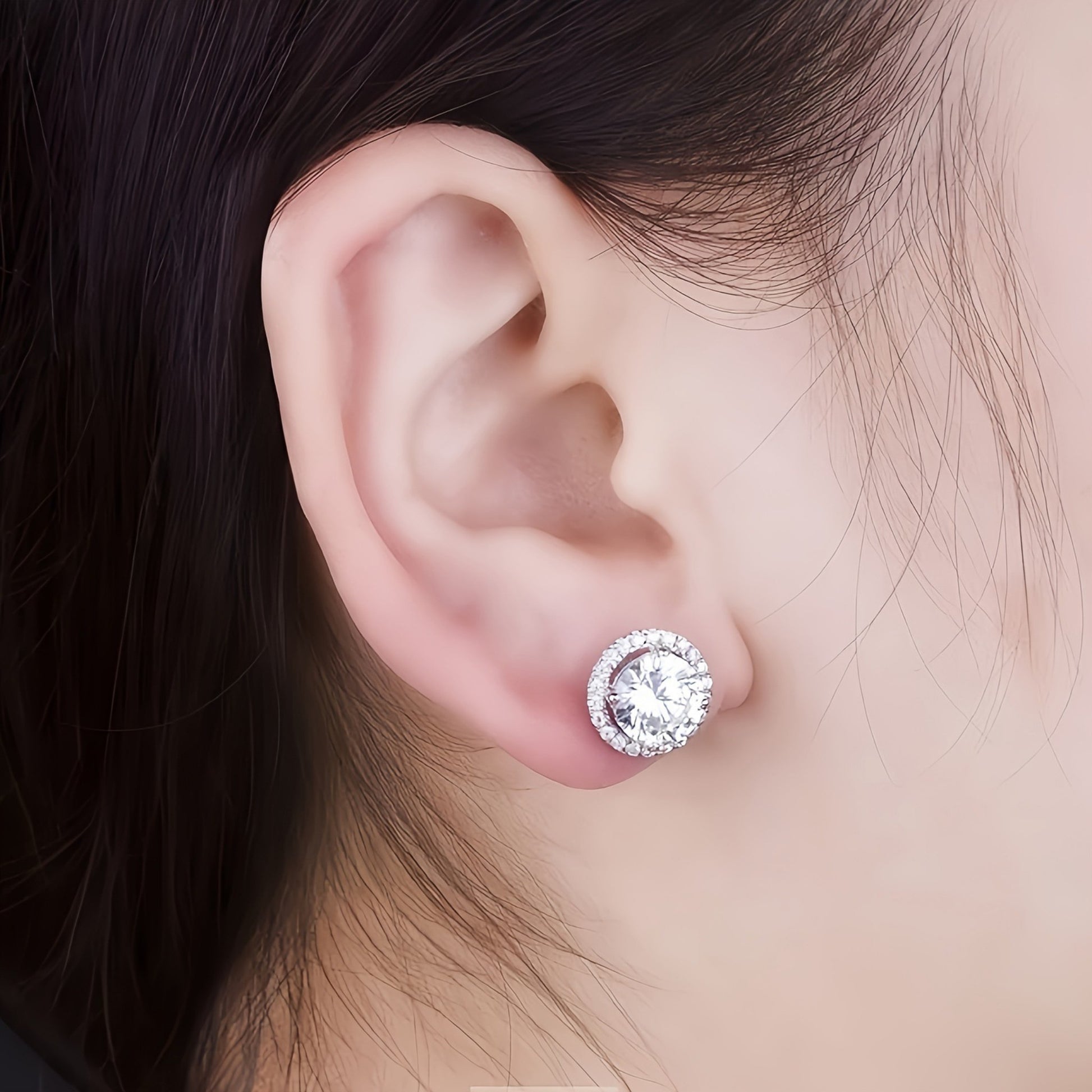 Close Up of 1 Carat Princess Cut Halo Moissanite Stud Earrings on Human Ear, Brilliant Sparkle, 925 Sterling Silver, SYG Jewelry