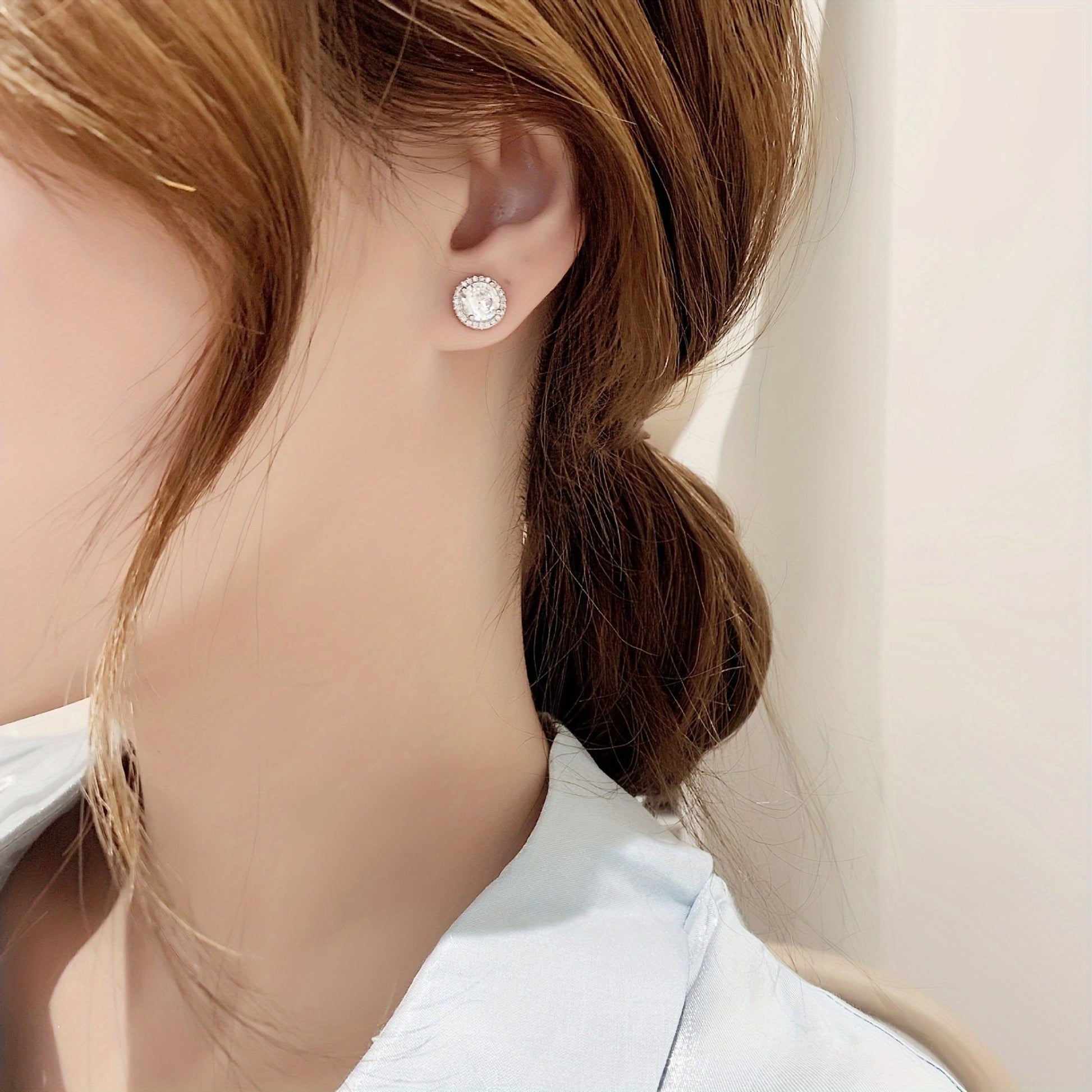 Close Up of 1 Carat Halo Moissanite Stud Earrings Worn on Ear, 925 Sterling Silver, Sparkling Lab Diamond Earrings for Daily Wear, SYG Jewelry