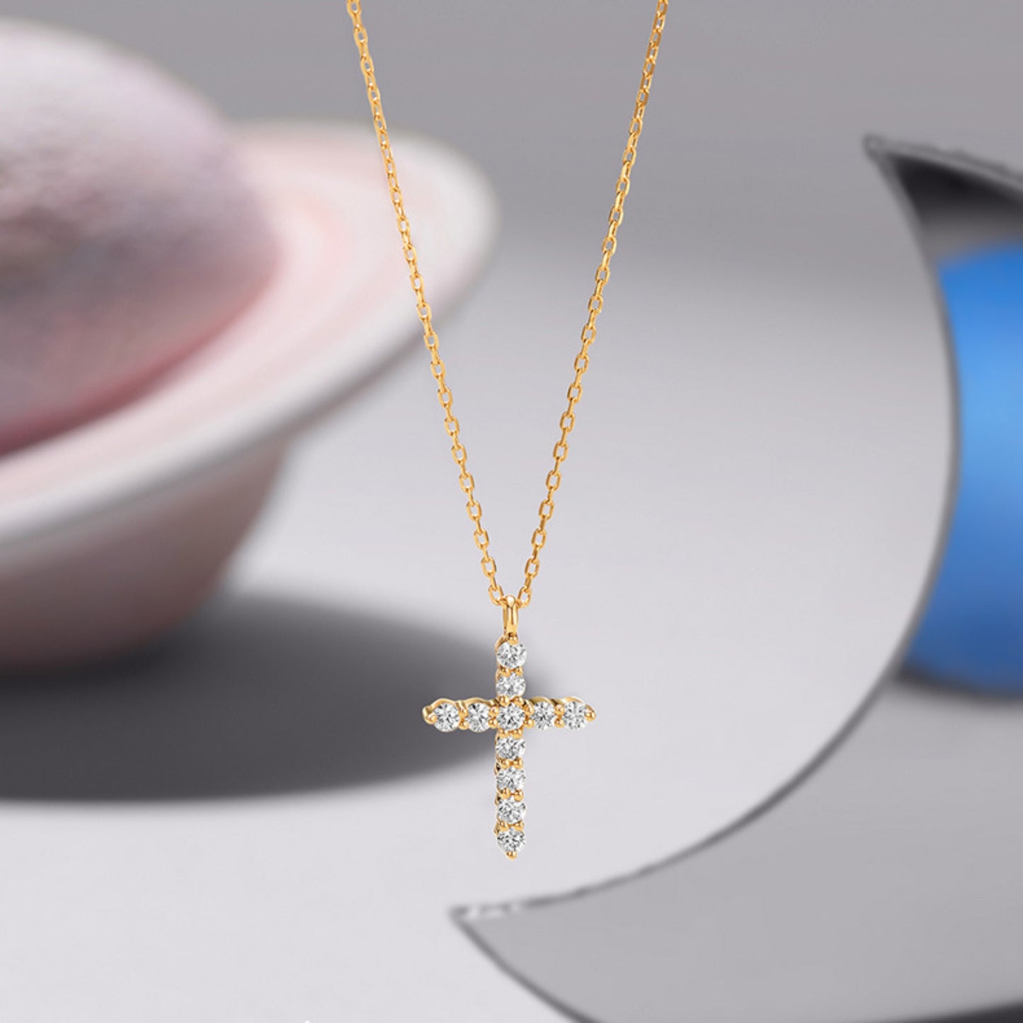 Close up of full diamond cross necklace on neck, minimalist everyday jewelry