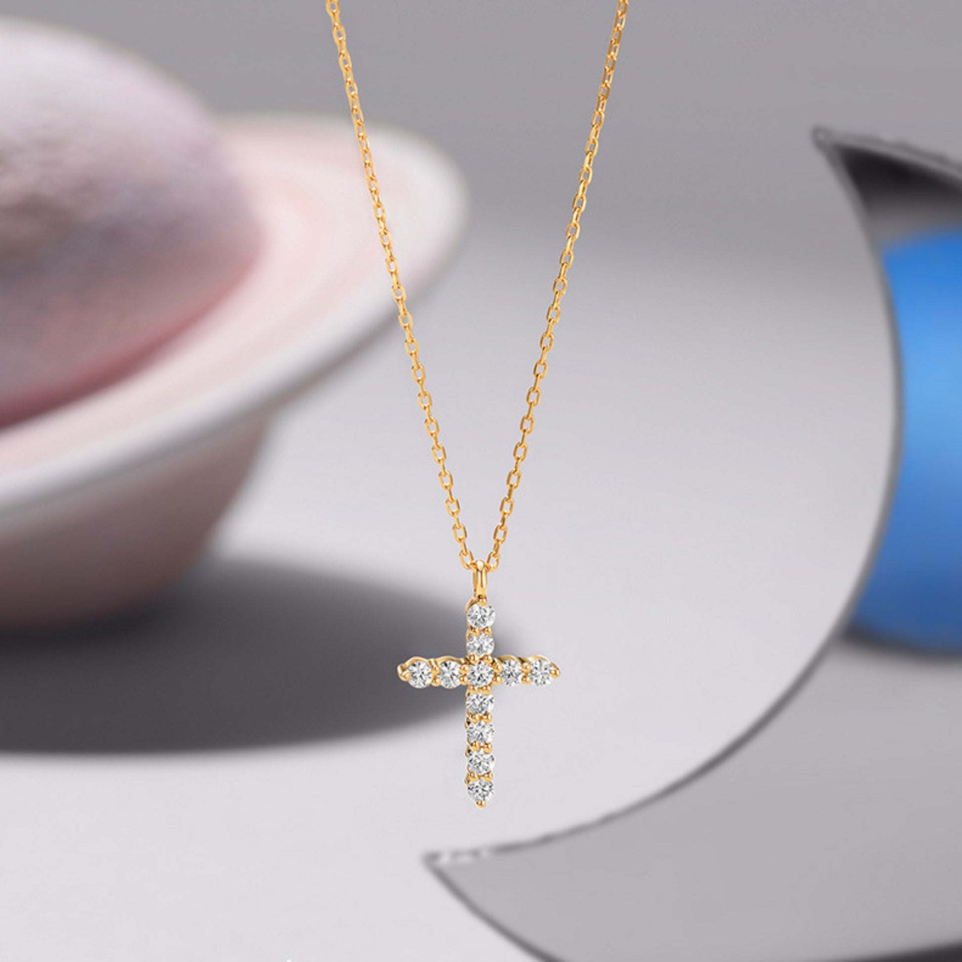Close up of full diamond cross necklace on neck, minimalist everyday jewelry