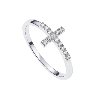 Model wearing dainty cross ring, minimalist everyday jewelry for women